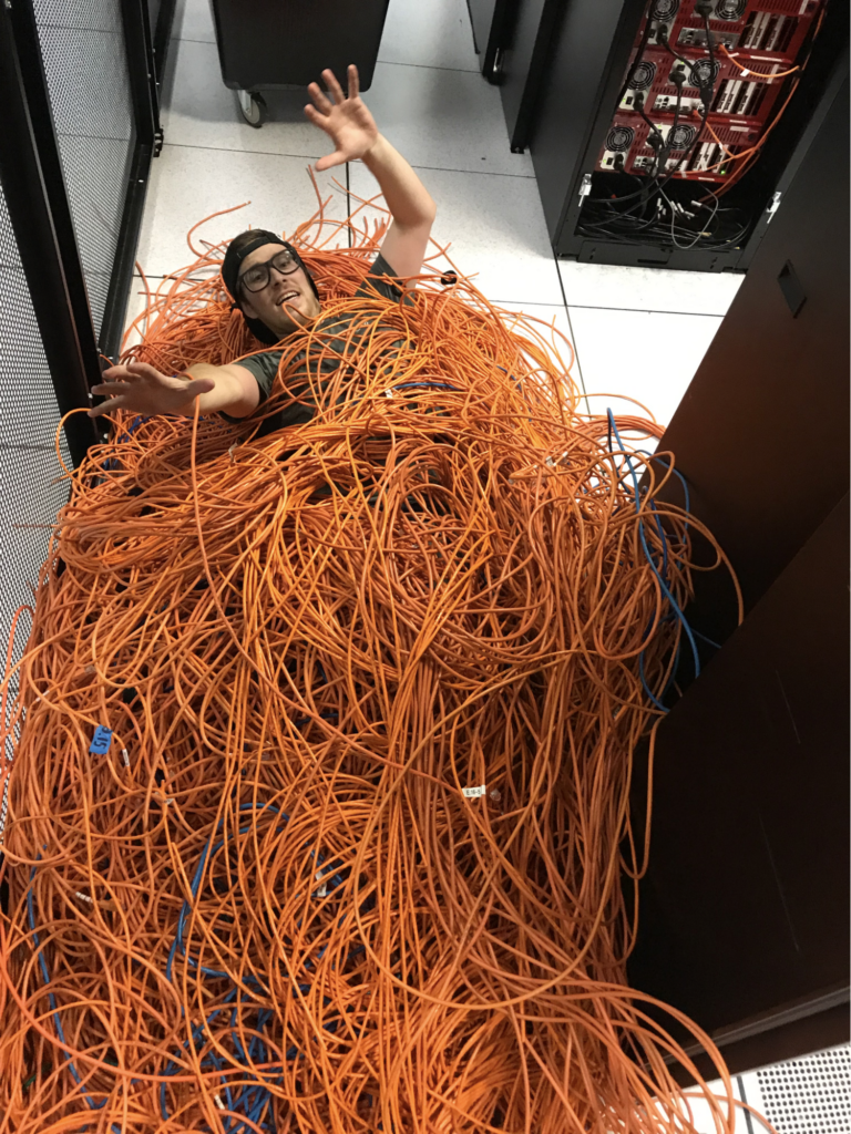 An image of a data center manager with decommissioned cables. 