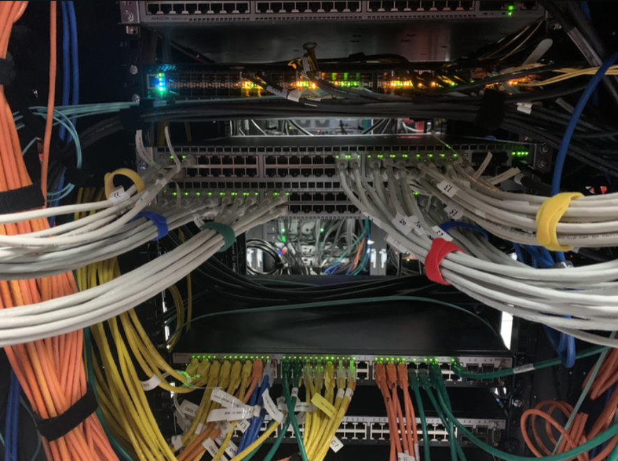 An image of network switches in a data center rack.