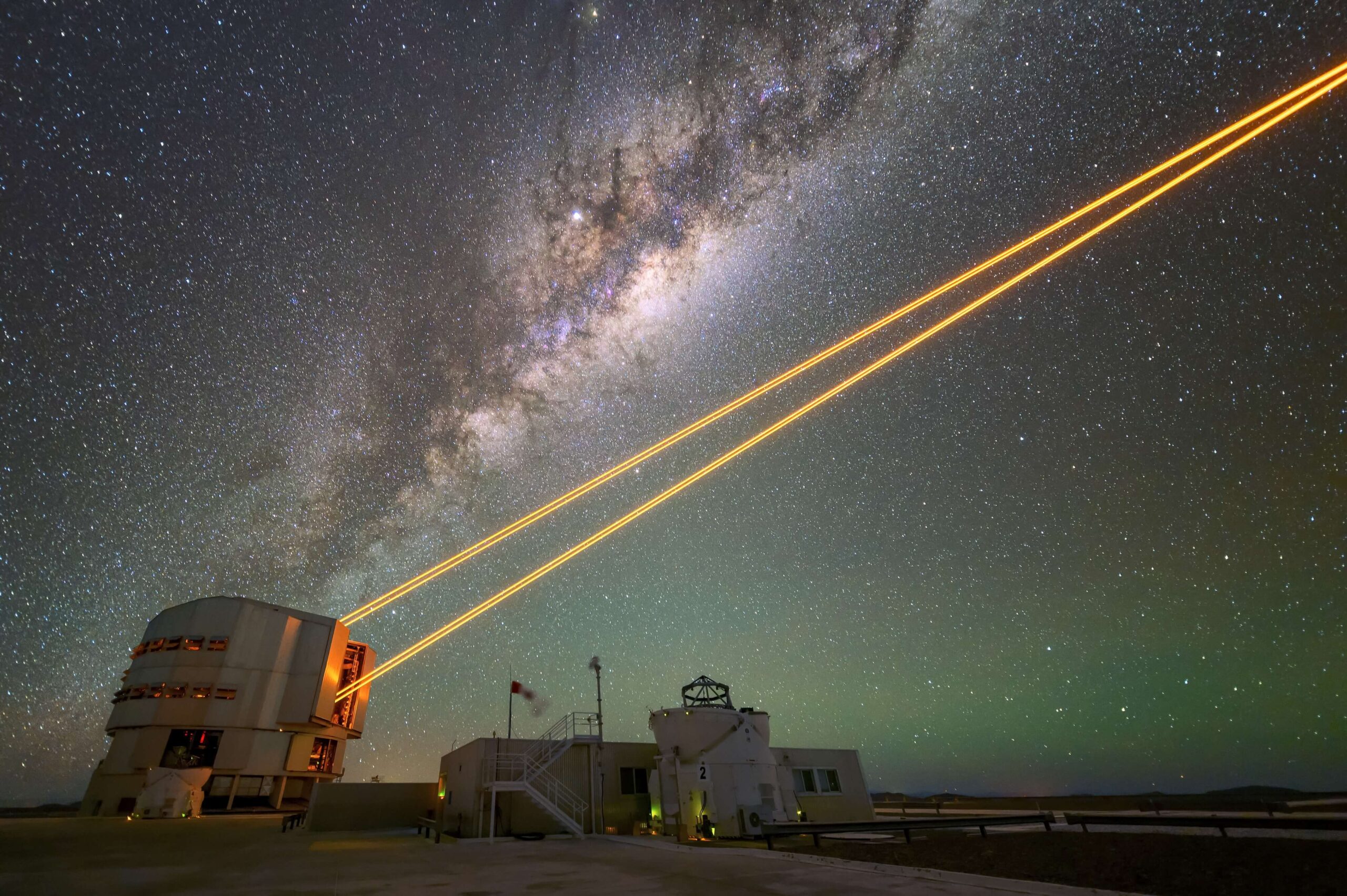 An image from the European Southern Observatory showing lasers guiding a high-powered telescope. 